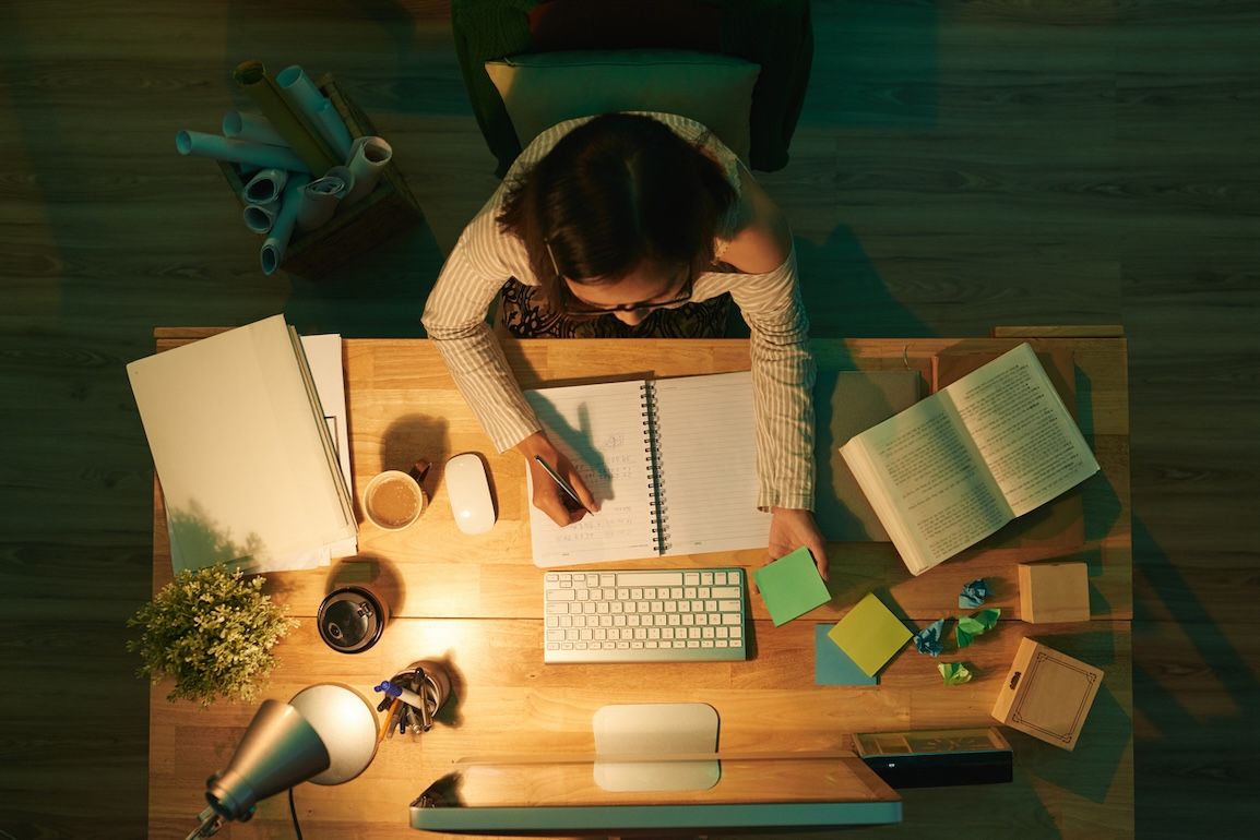 Student busy studying at night.