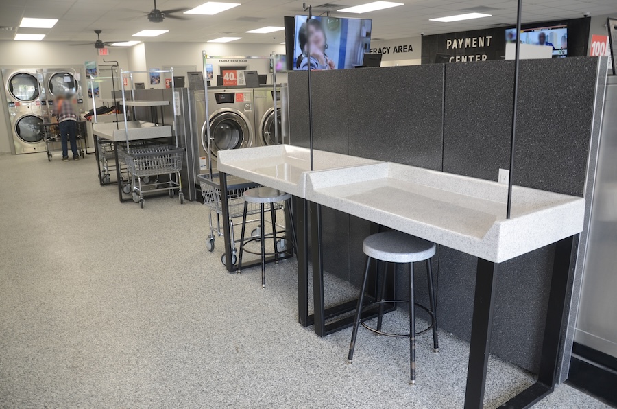 Tables and chairs in laundromat
